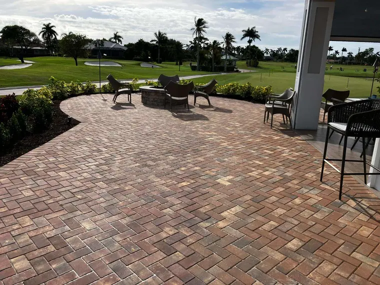 Finished paver patio with seating and golf course view