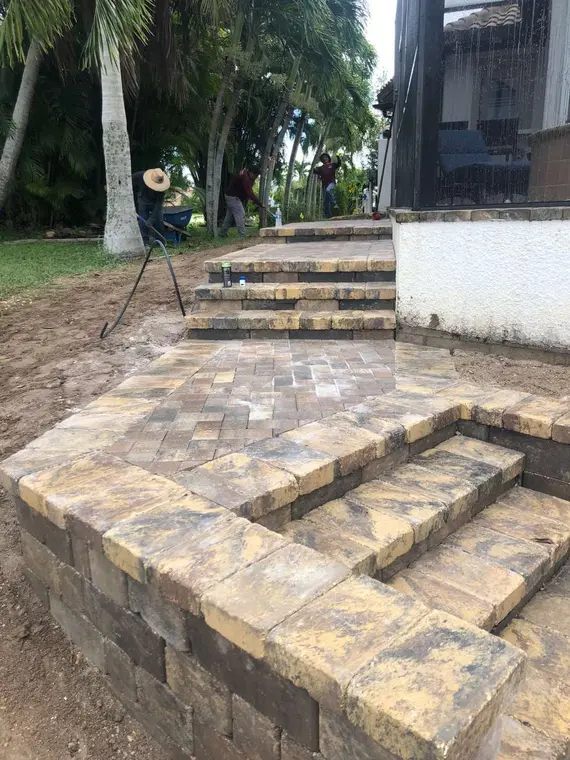 Multi-level paver steps integrated into the landscape