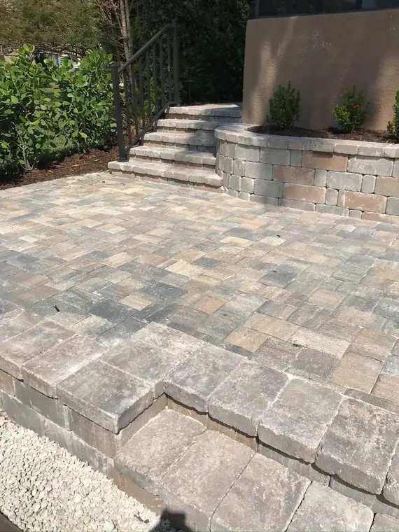 Terraced paver area with coordinating block wall